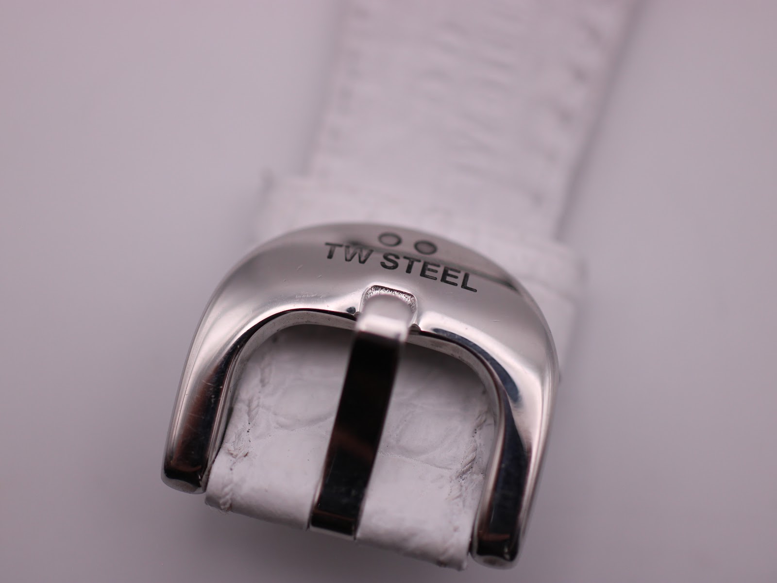 Close-up of the polished stainless steel buckle with 'TW STEEL' engraving.