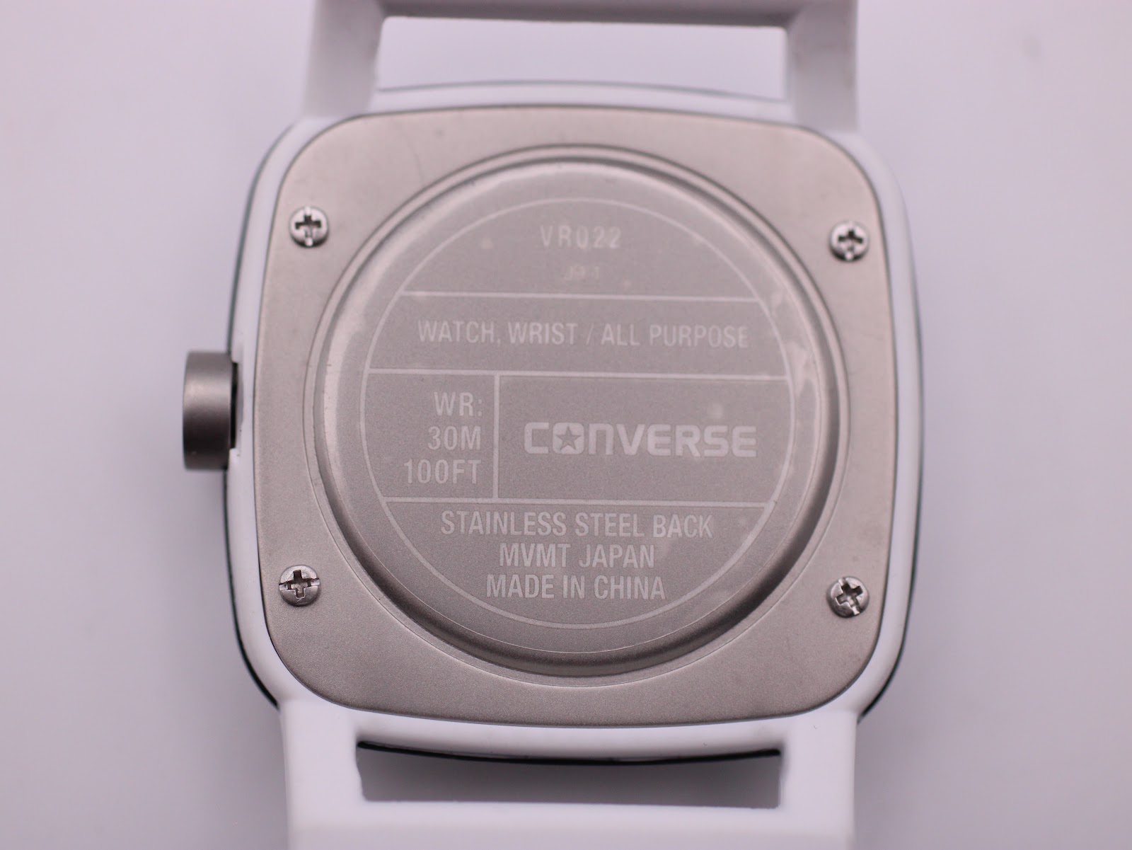 Case back of the Converse VRQ22, showing model VRQ22, WR 30M/100FT, stainless steel back, movement Japan, made in China.