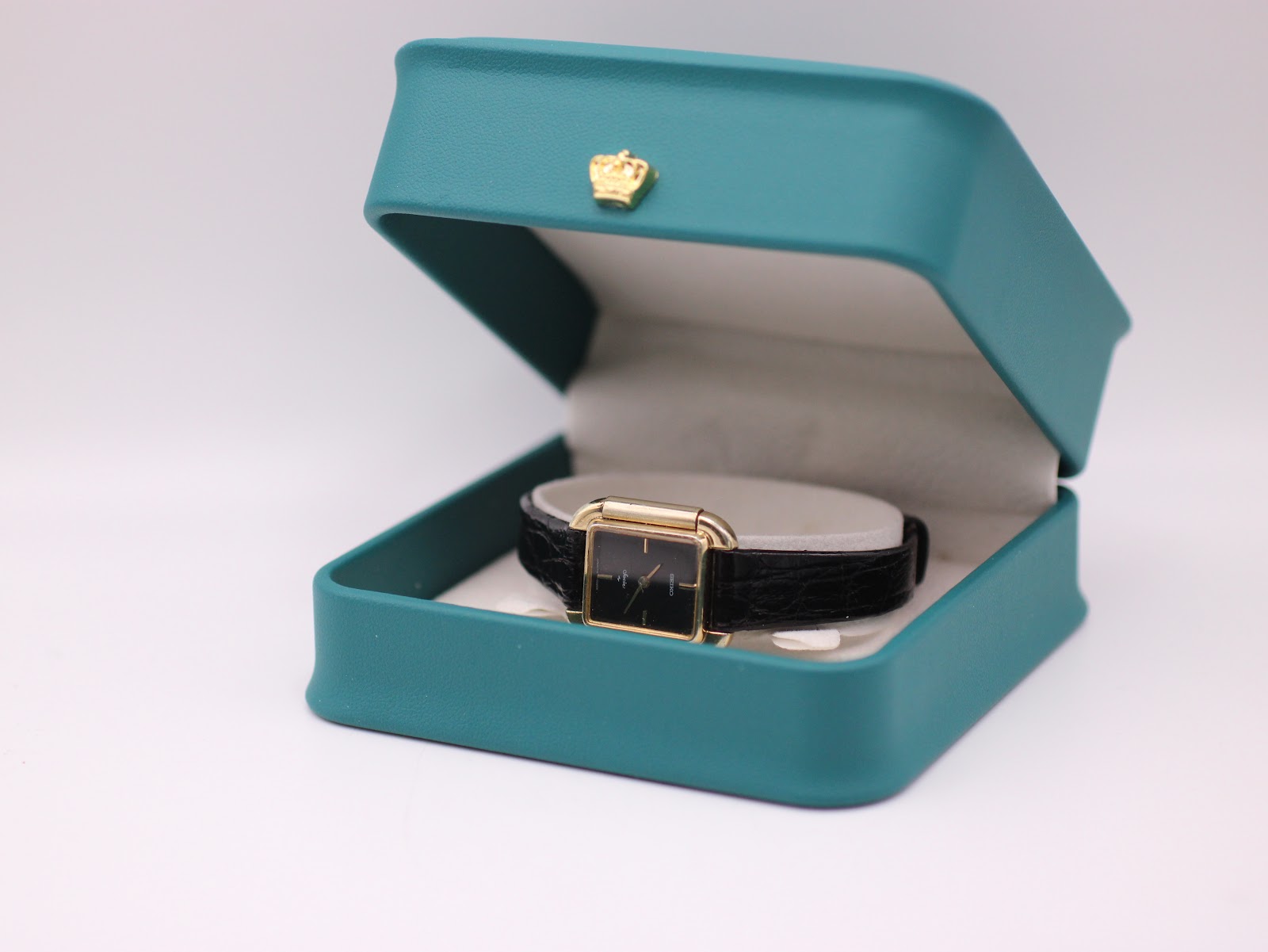 The Seiko Socie watch resting in a generic green leatherette display box, against a white background.