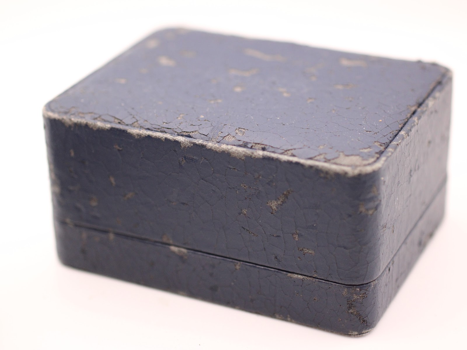 Exterior view of the original vintage blue Seiko presentation box, showing significant age and wear.