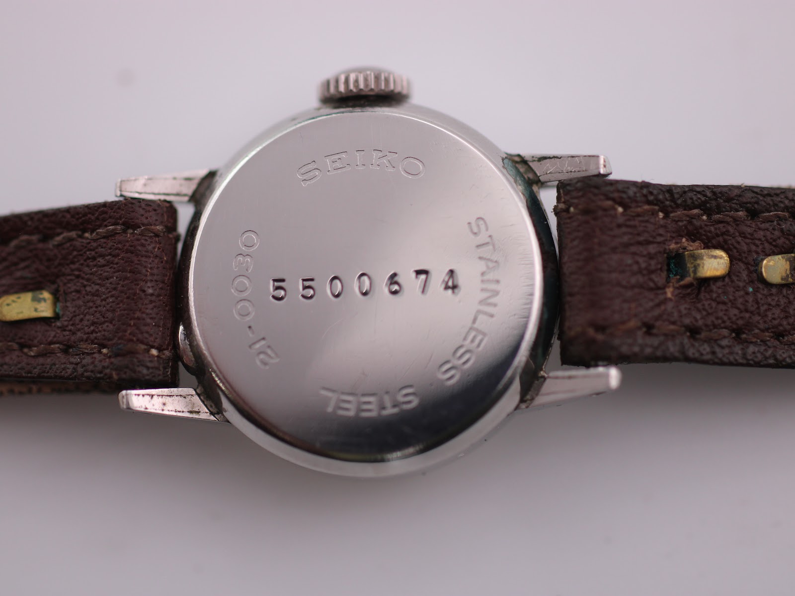 Close-up of the stainless steel case back with 'SEIKO', '5500674' serial, and 'STAINLESS STEEL' engravings.