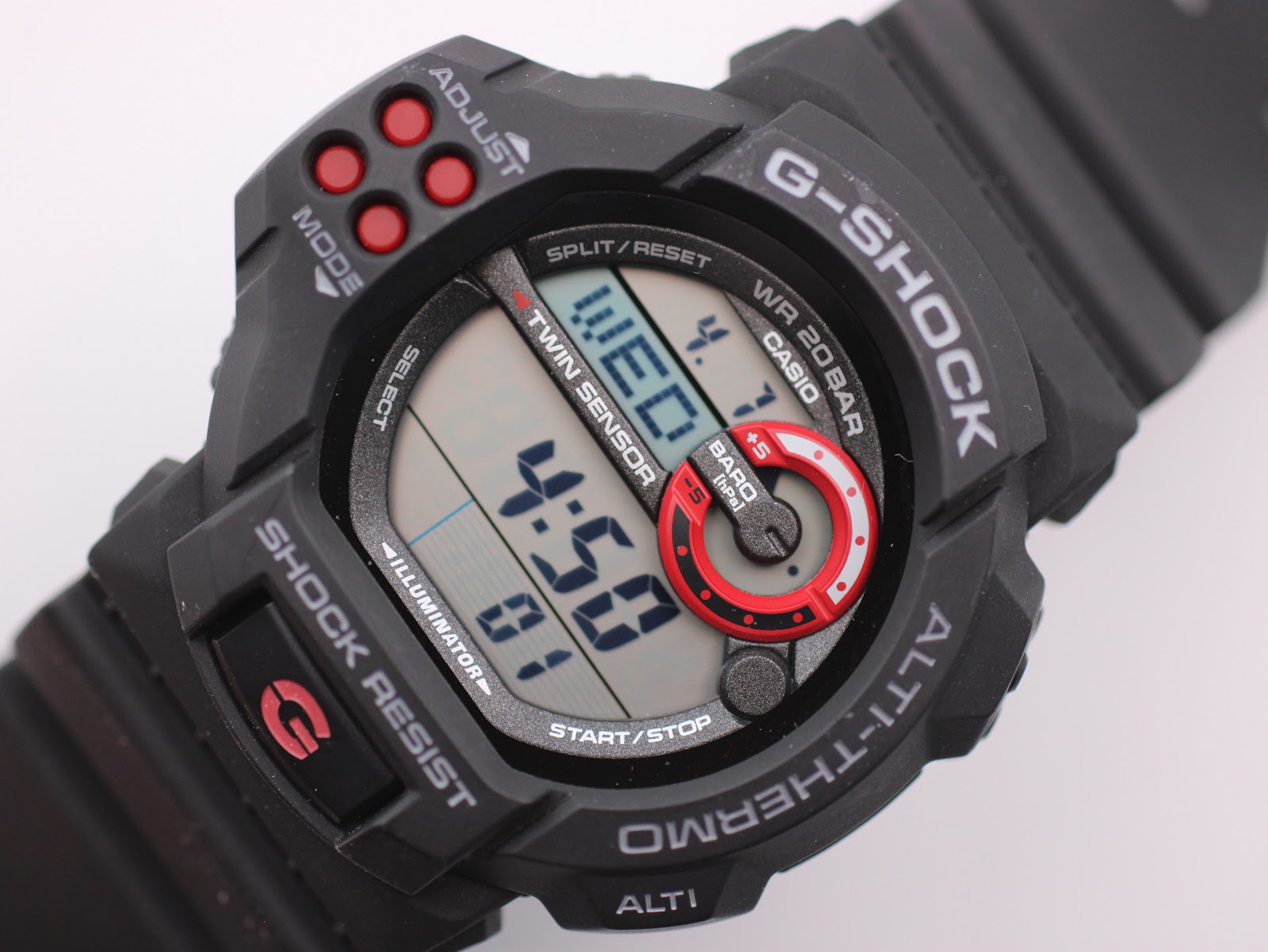 Close-up, angled view of the Casio G-Shock GDF-100 dial, highlighting the digital display, twin sensor text, and red barometer graphic.