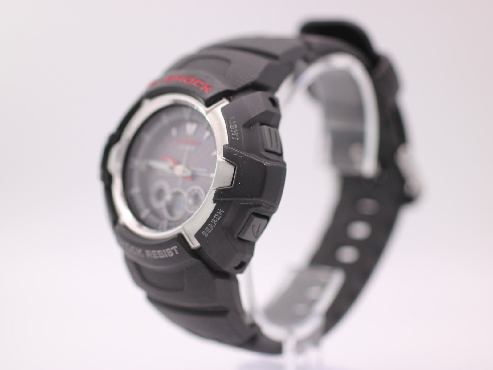 Angled side view of the G-Shock GW-1500A showing the right side of the black resin case with 'light' and 'search' buttons.
