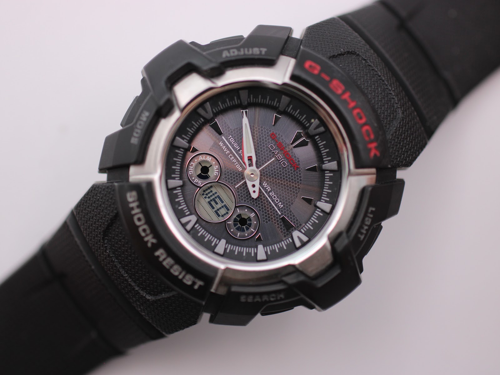 Detailed angled close-up of the grey textured dial, showing the hands, digital displays, and 'wave ceptor' 'tough solar' markings.