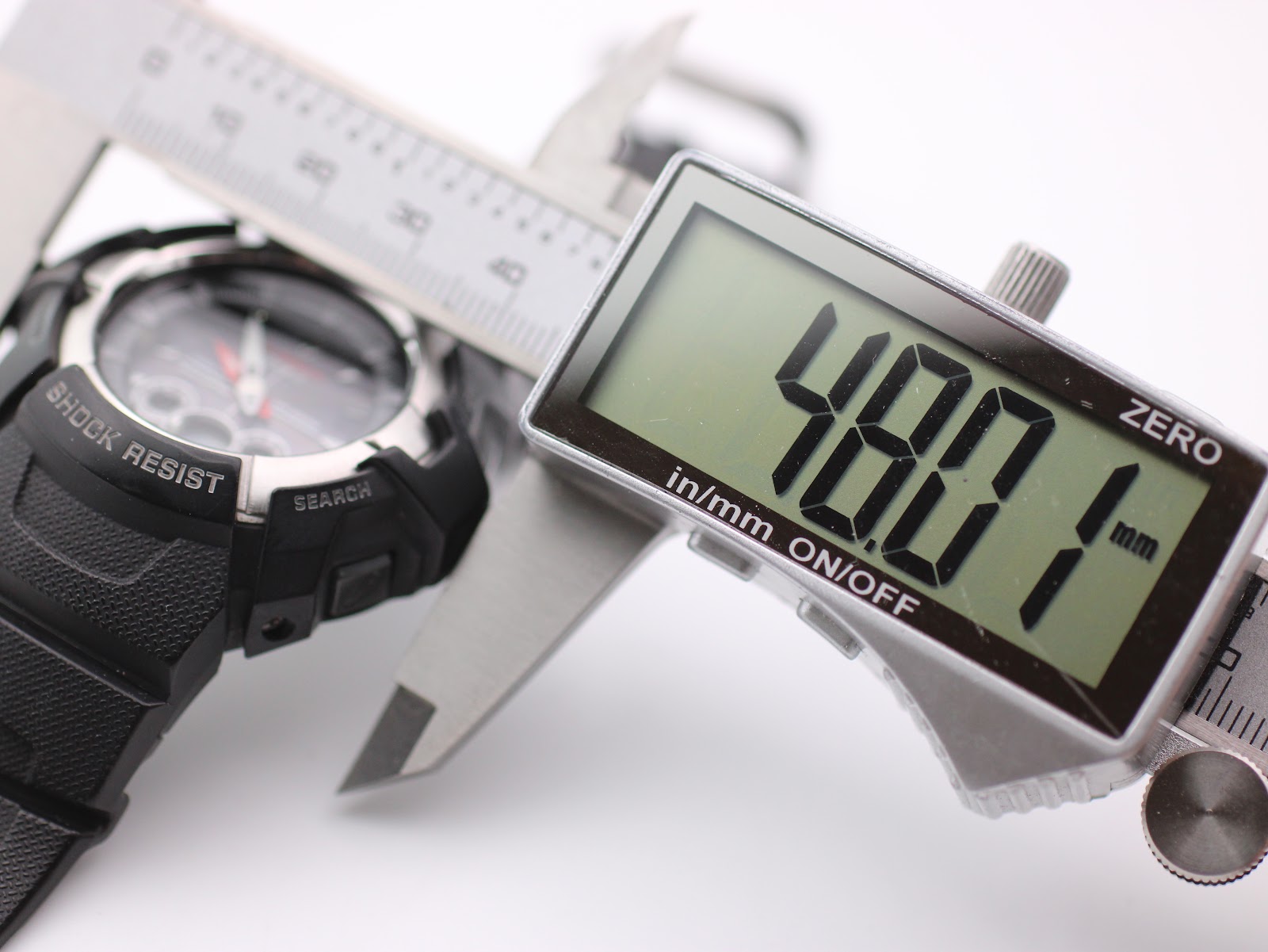 Digital caliper display showing a precise case diameter measurement of 48.01 mm for the Casio G-Shock watch.