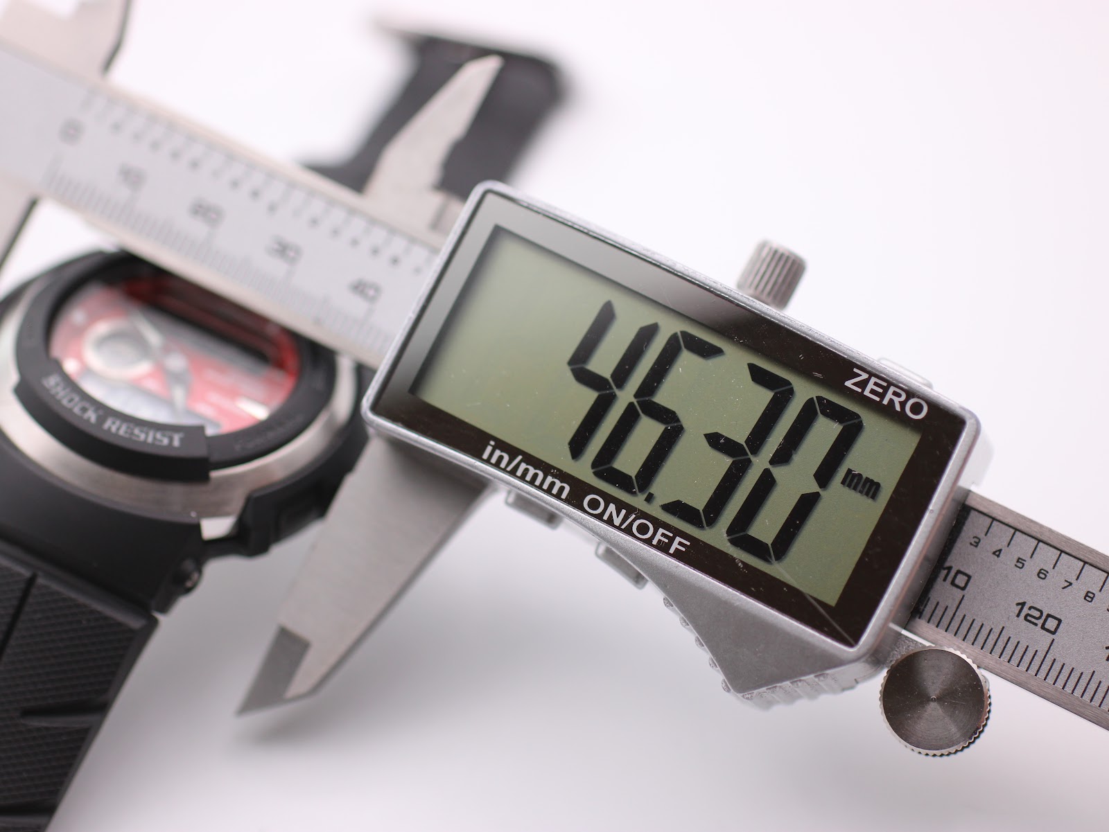 Digital caliper measuring the case diameter of the Casio G-Shock G-300, displaying 46.30mm.
