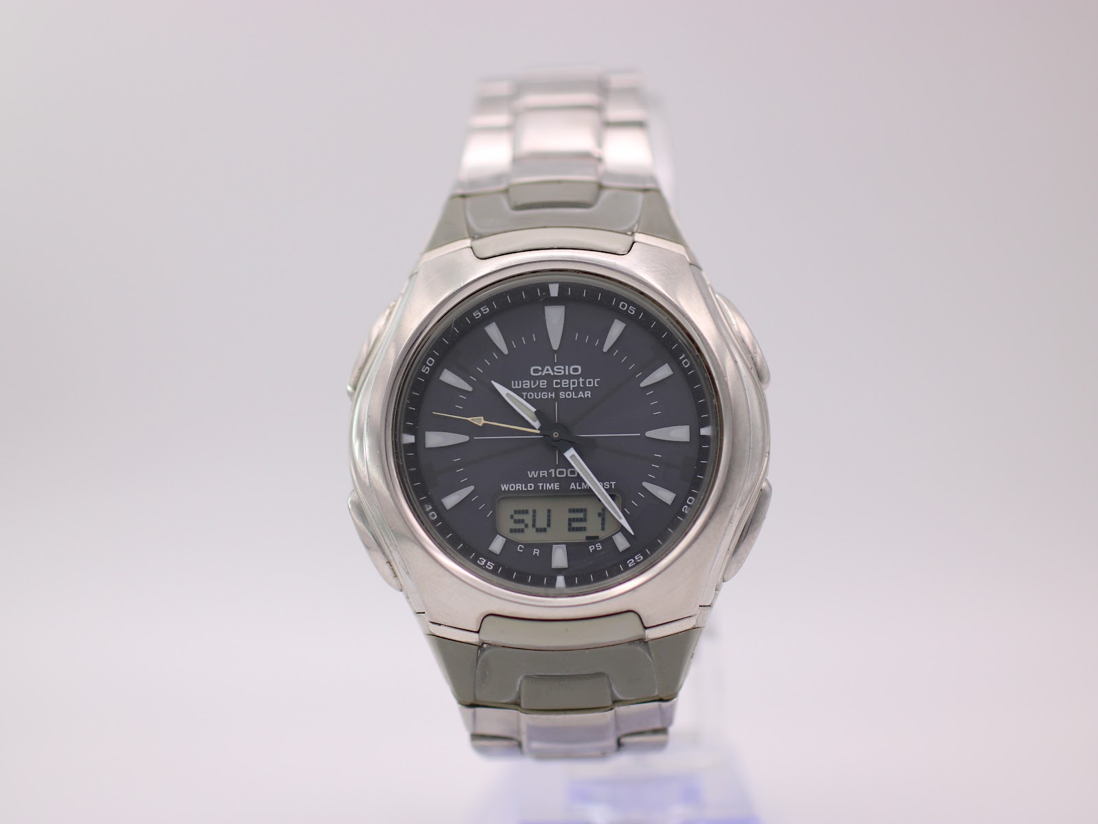 Front view of Casio Wave Ceptor WVA-430U watch with grey ana-digi dial and silver steel bracelet.