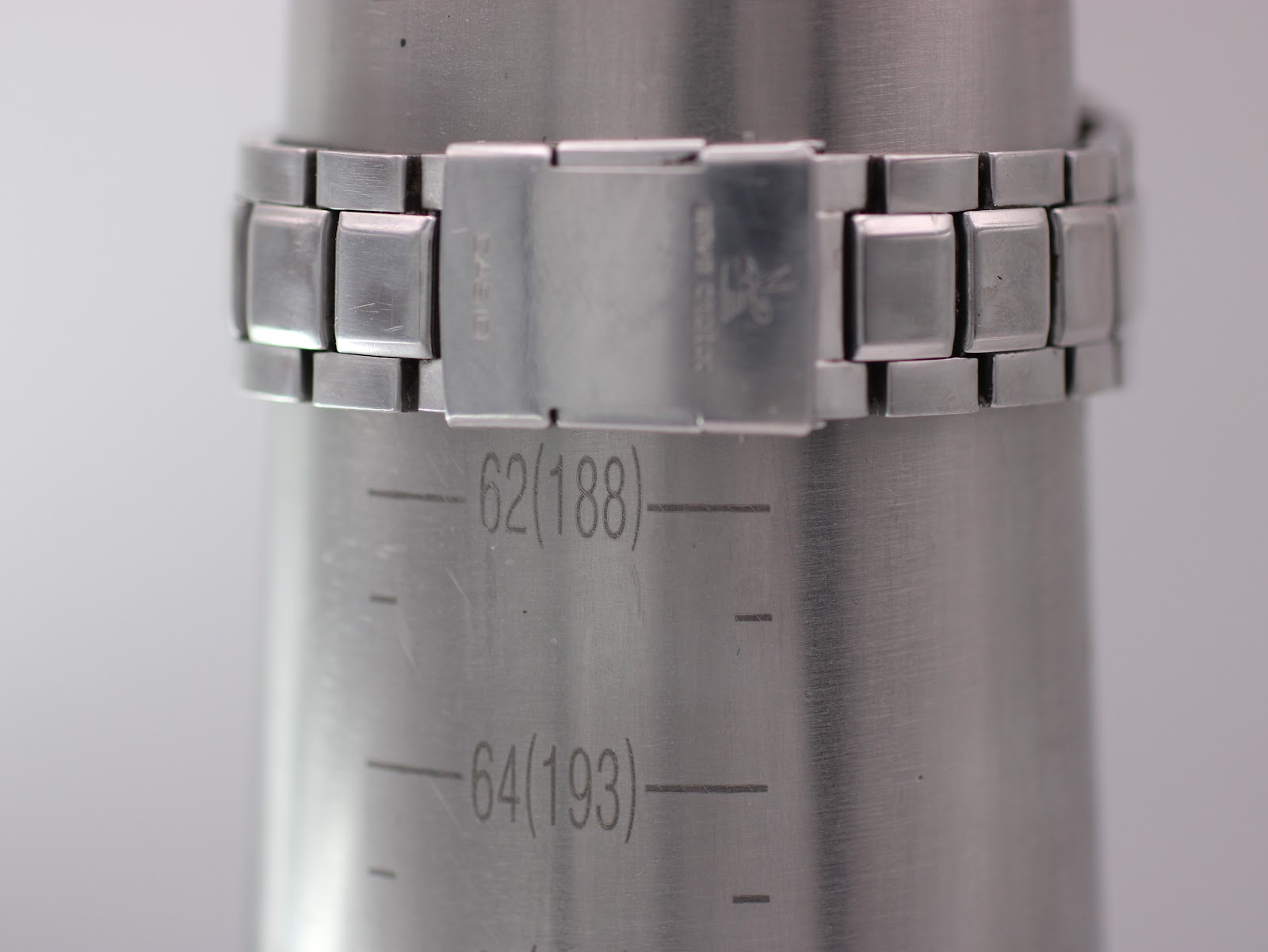 Close-up of the watch bracelet on a wrist sizing gauge, indicating a wrist circumference of 188mm or 18.8cm.