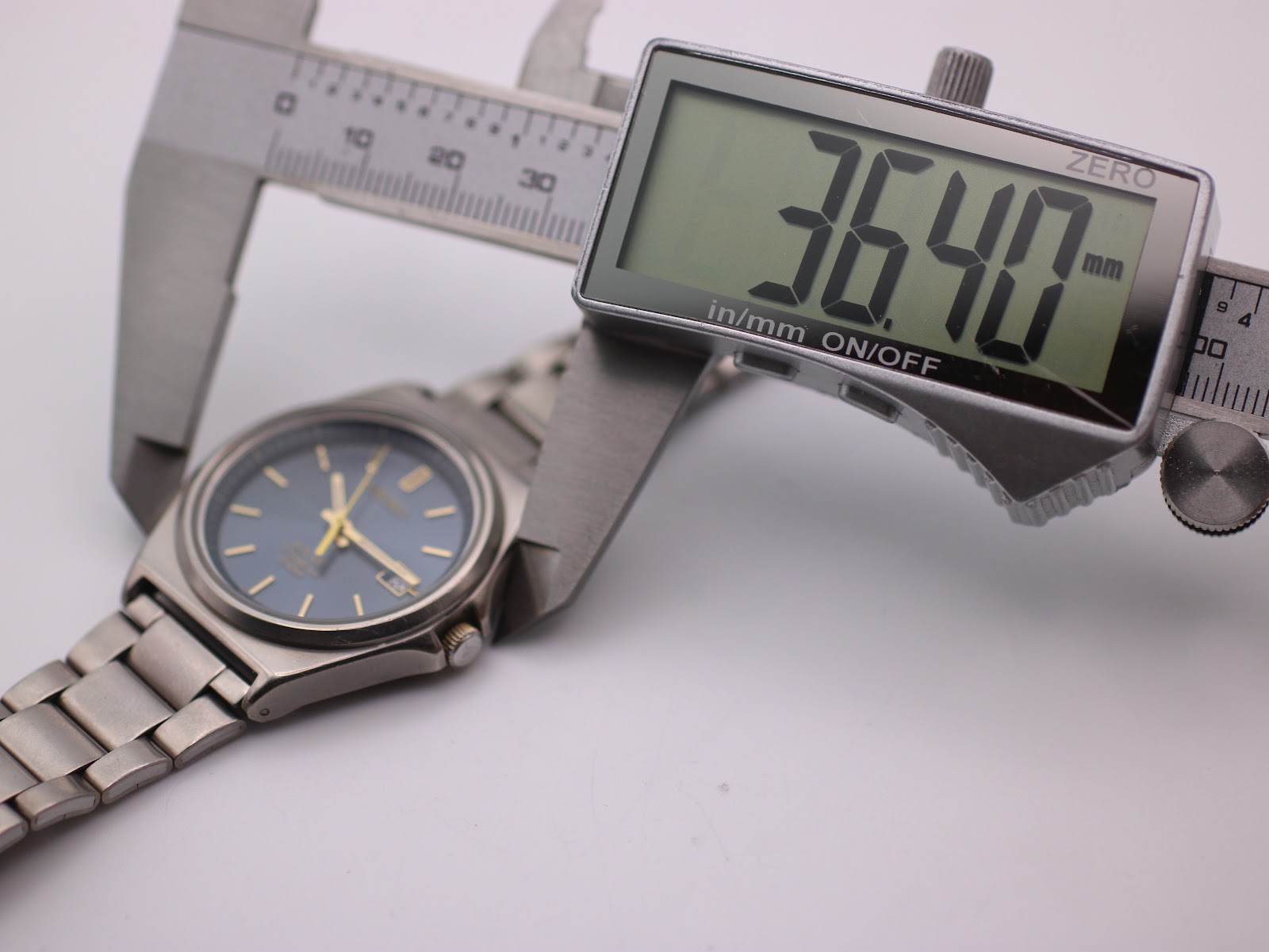 Digital caliper measuring the Seiko watch case diameter at 36.40mm, clearly displayed on the screen.