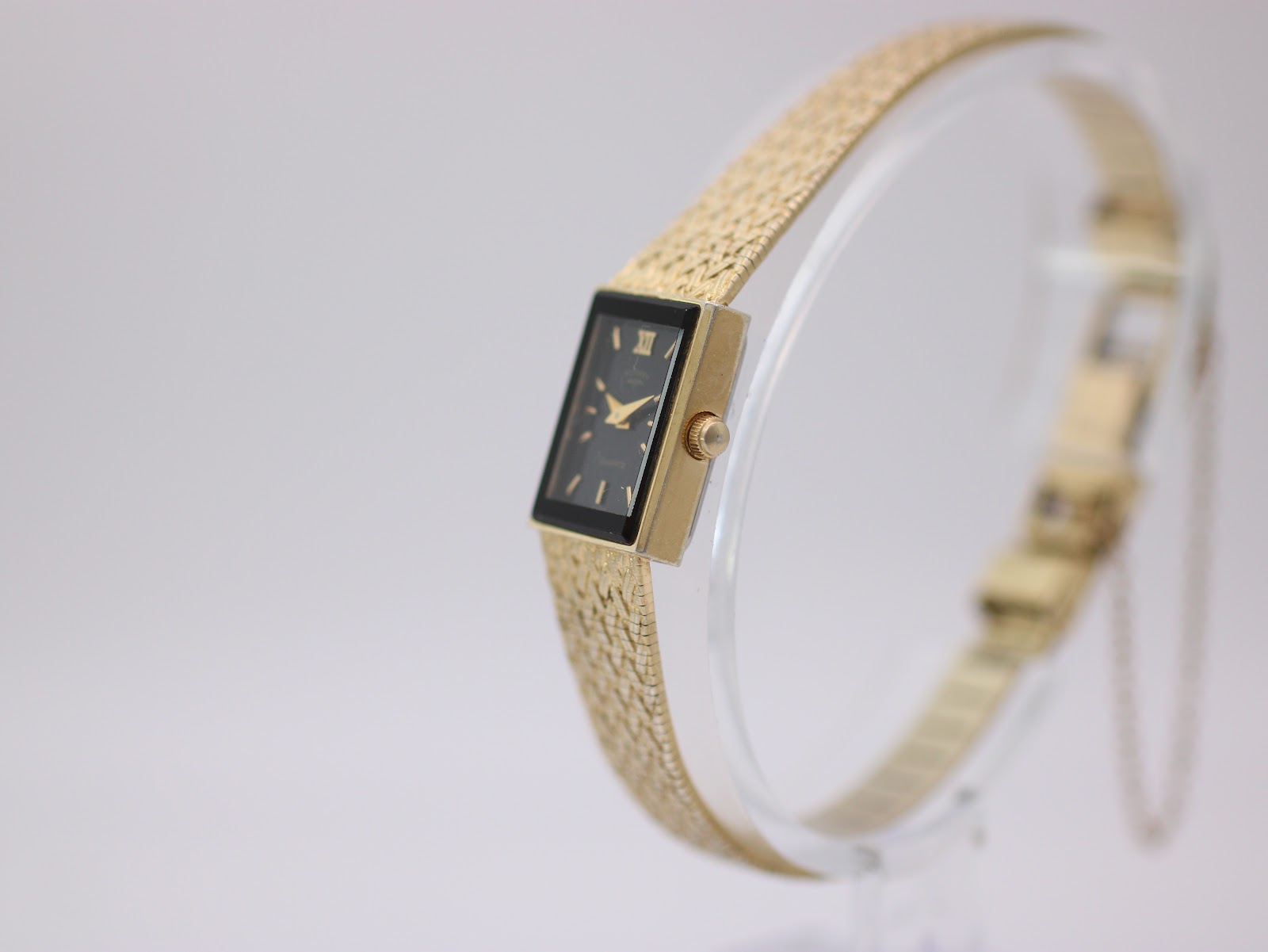 The Rotary watch nestled inside its original dark red presentation box with gold branding.