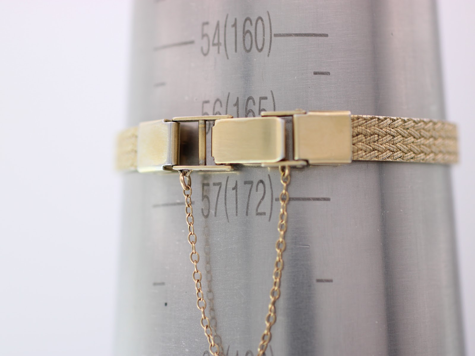 Digital caliper measuring the case width of the watch, displaying a reading of 12.63mm.
