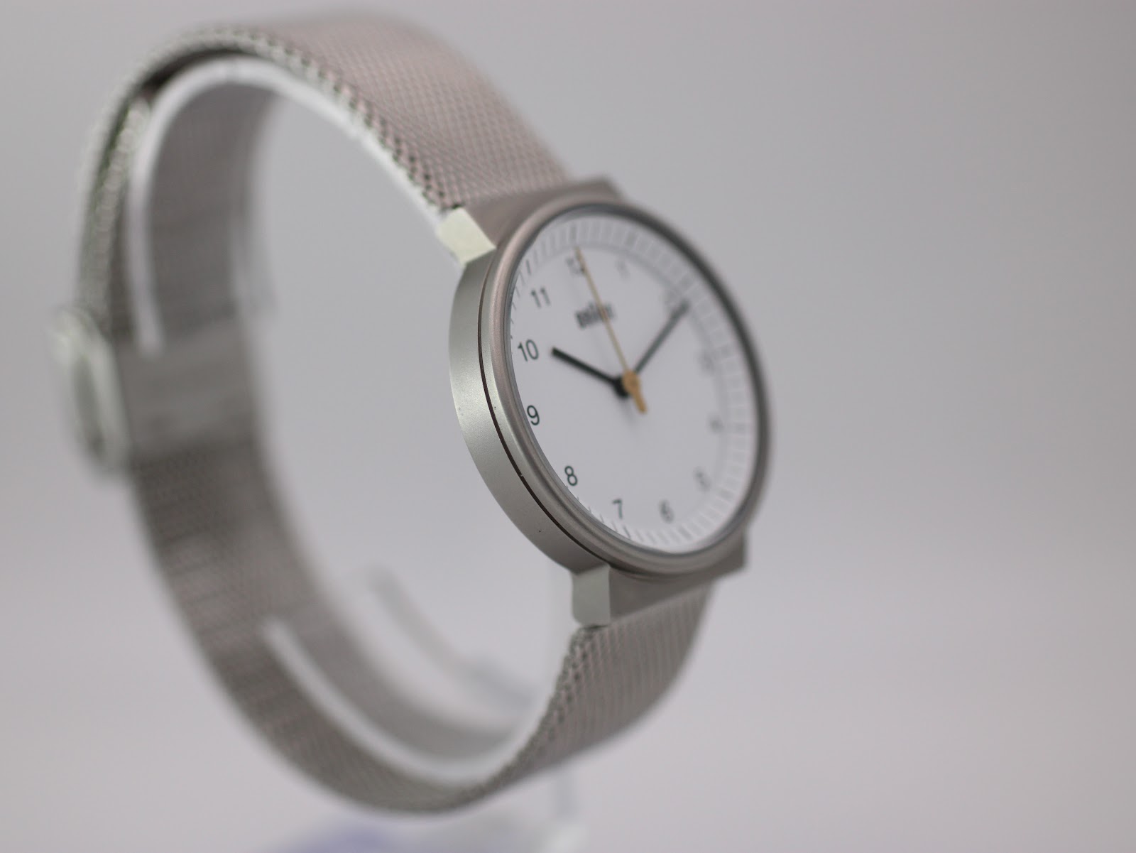 Another angled side view of the Braun watch from a slightly different perspective, highlighting the slim profile of the case and crown.