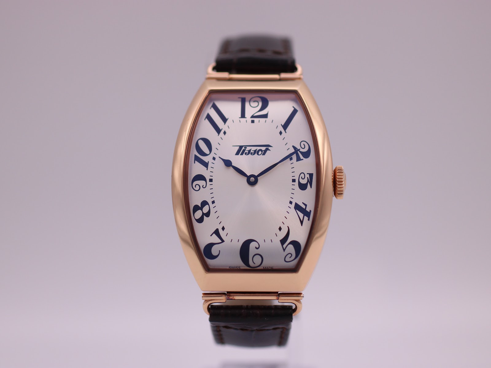 Original Tissot blue presentation box, open, with the watch and papers inside.