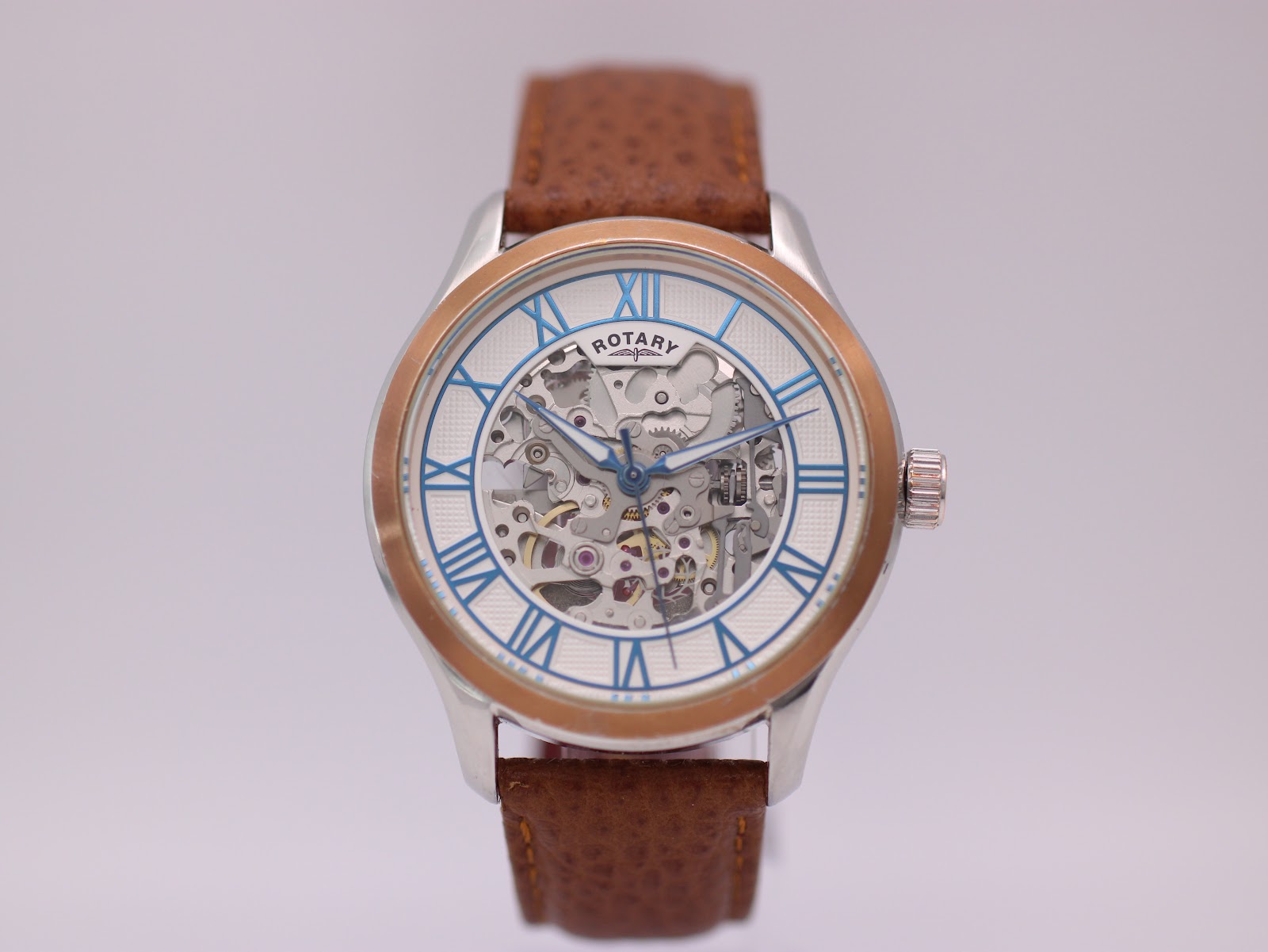 Front view of the Rotary GB00642/06 automatic watch with white skeleton dial and brown leather strap.