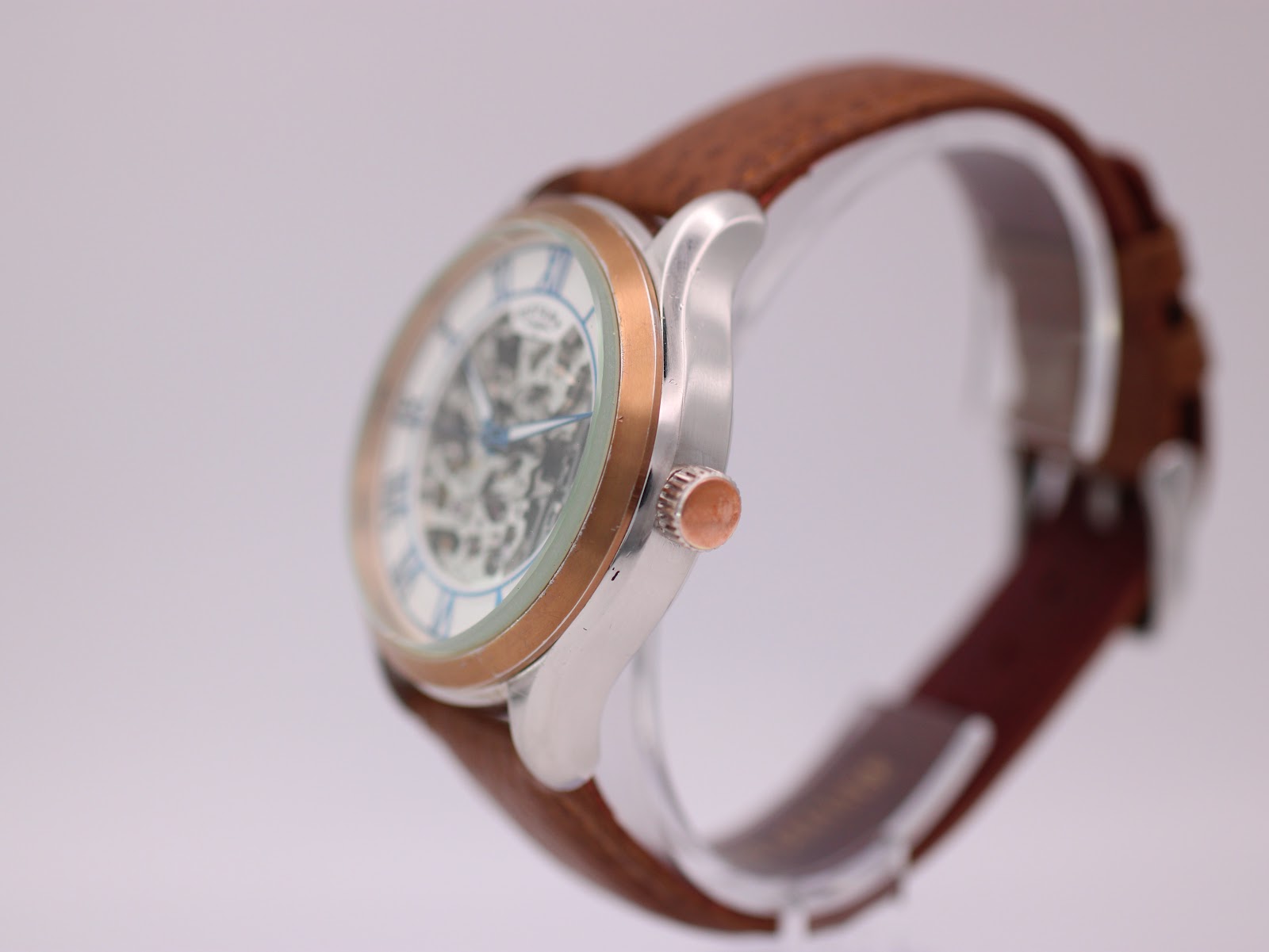 Right-side view of the Rotary watch, showing the rose gold-tone crown and case profile.