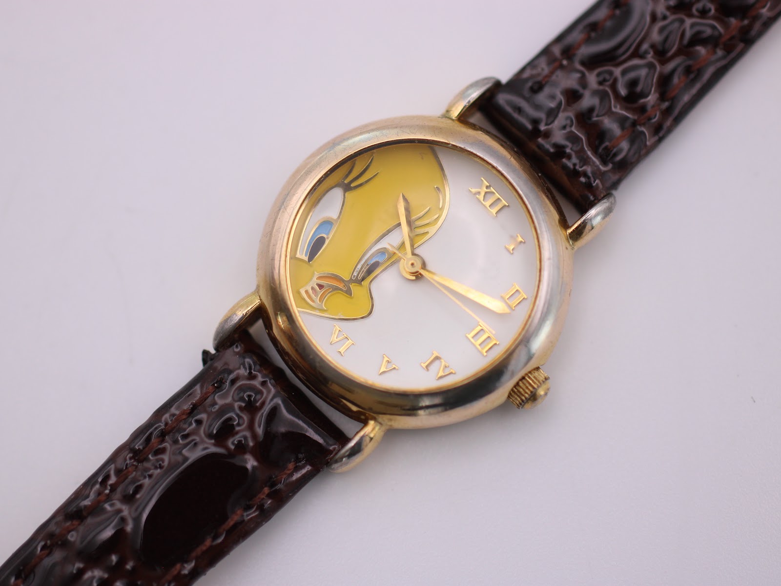 Close-up front view of the Tweety Bird dial, clearly showing the character and gold-tone hands.
