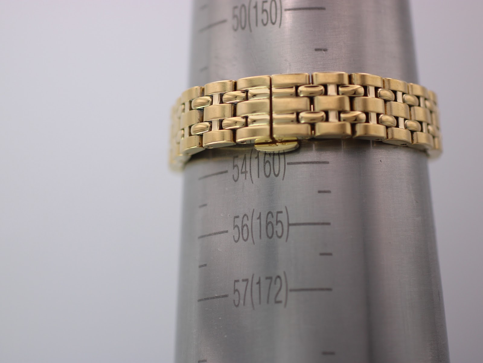 Watch bracelet on a wrist sizing gauge, showing a measurement aligning with approximately 160mm circumference.