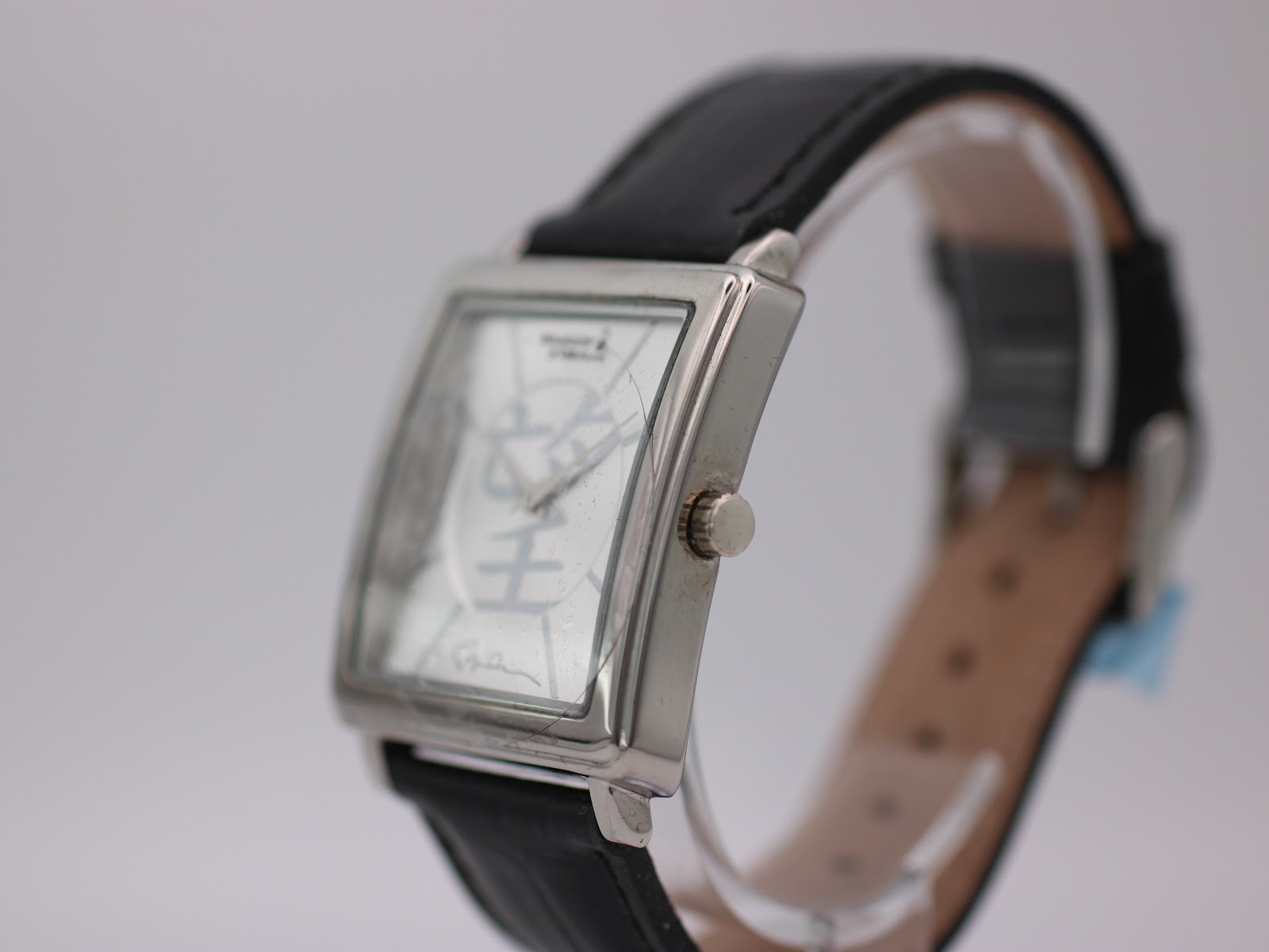 Close-up of the silver dial featuring the 'Hope' character and 'Whatever It Takes.org' logo.