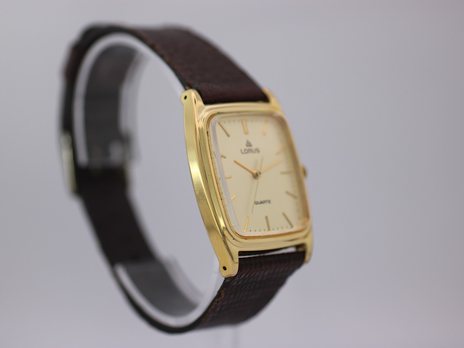Another angled side view of the Lorus watch, providing a different perspective of the case shape and strap attachment.