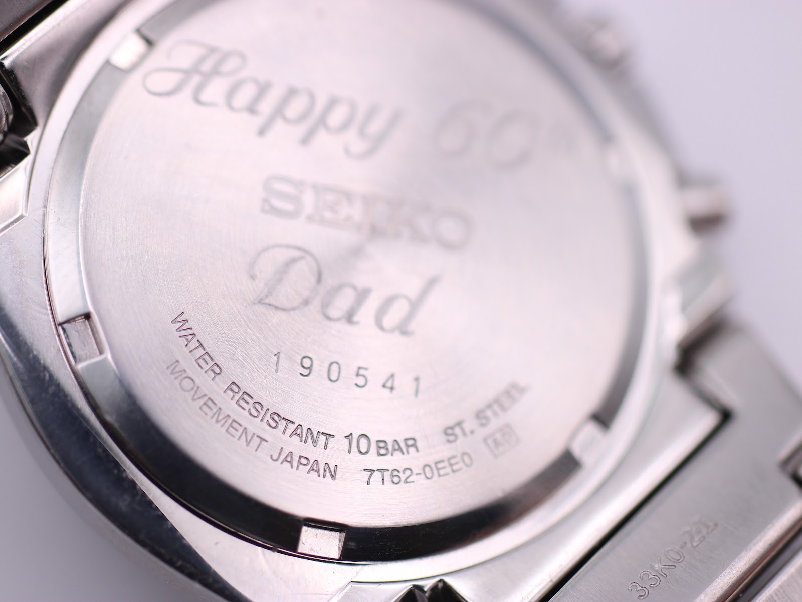 Detailed close-up of the case back engraving and markings, including serial 190541 and model 7T62-0EE0.