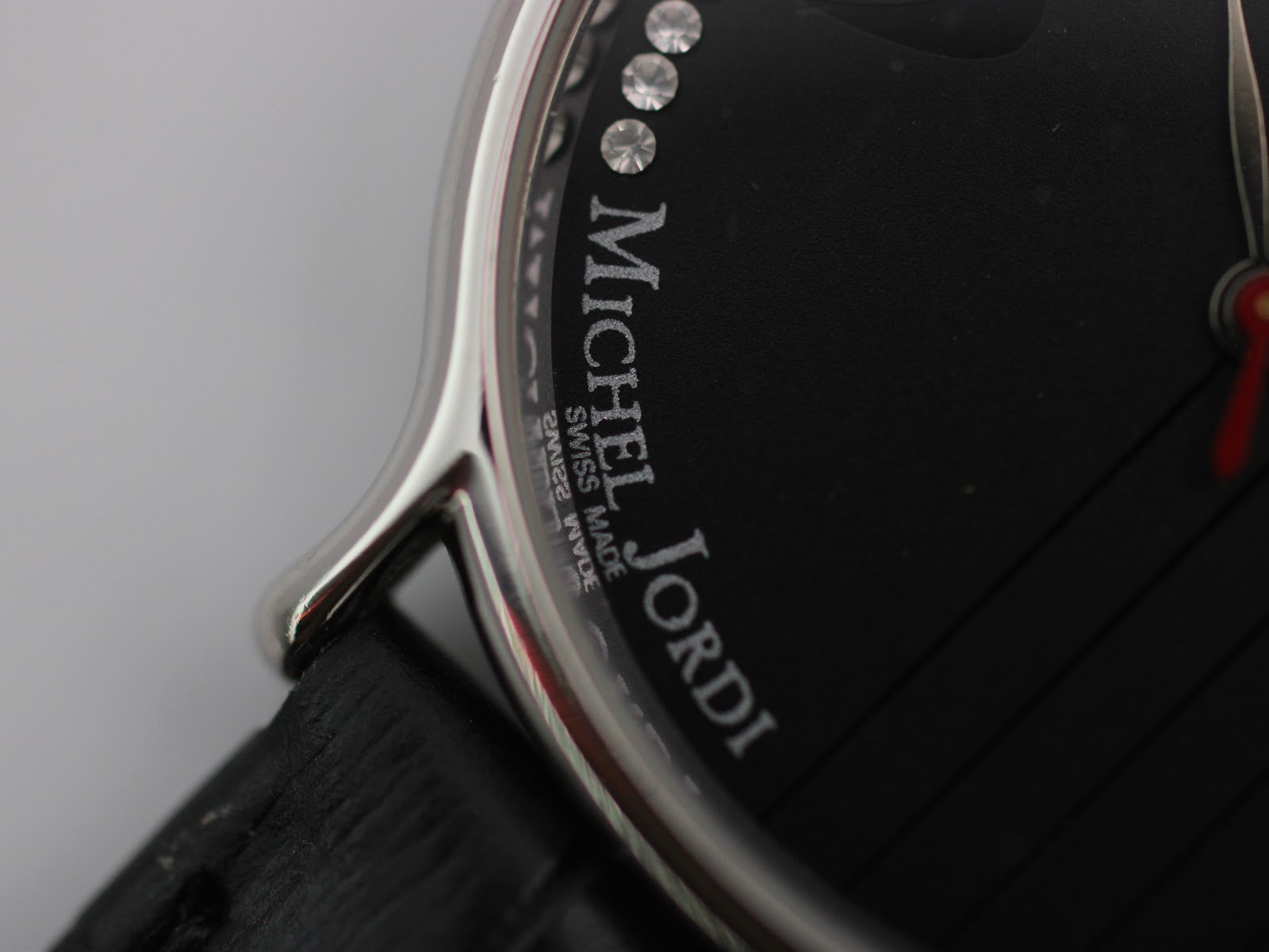 Extreme close-up of the dial edge and lug area, showing case finish and strap attachment.