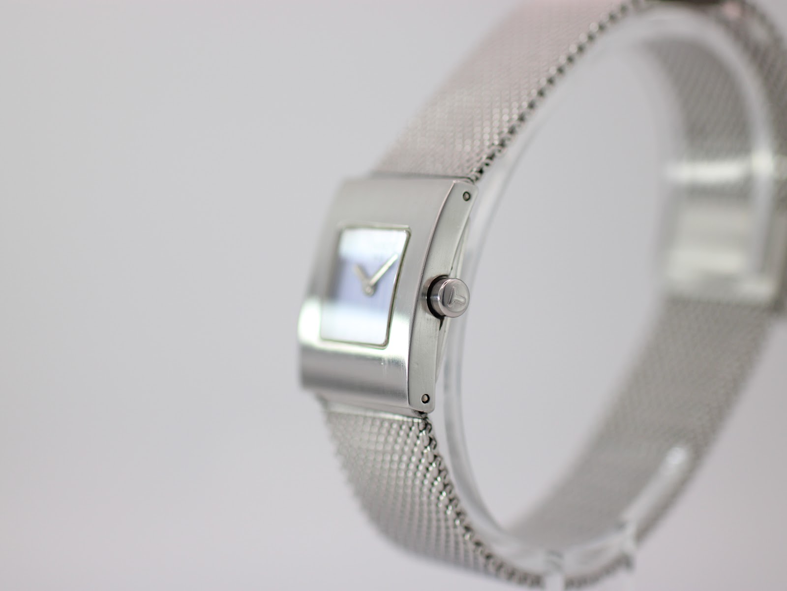 Side profile view of the Tissot L610K watch, highlighting the brushed finish of the case and the simple crown.