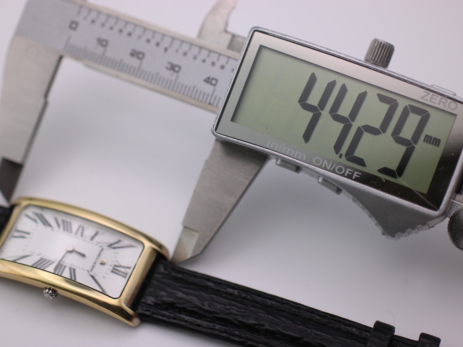 Digital caliper measuring the watch case length (lug-to-lug) at 44.29mm.