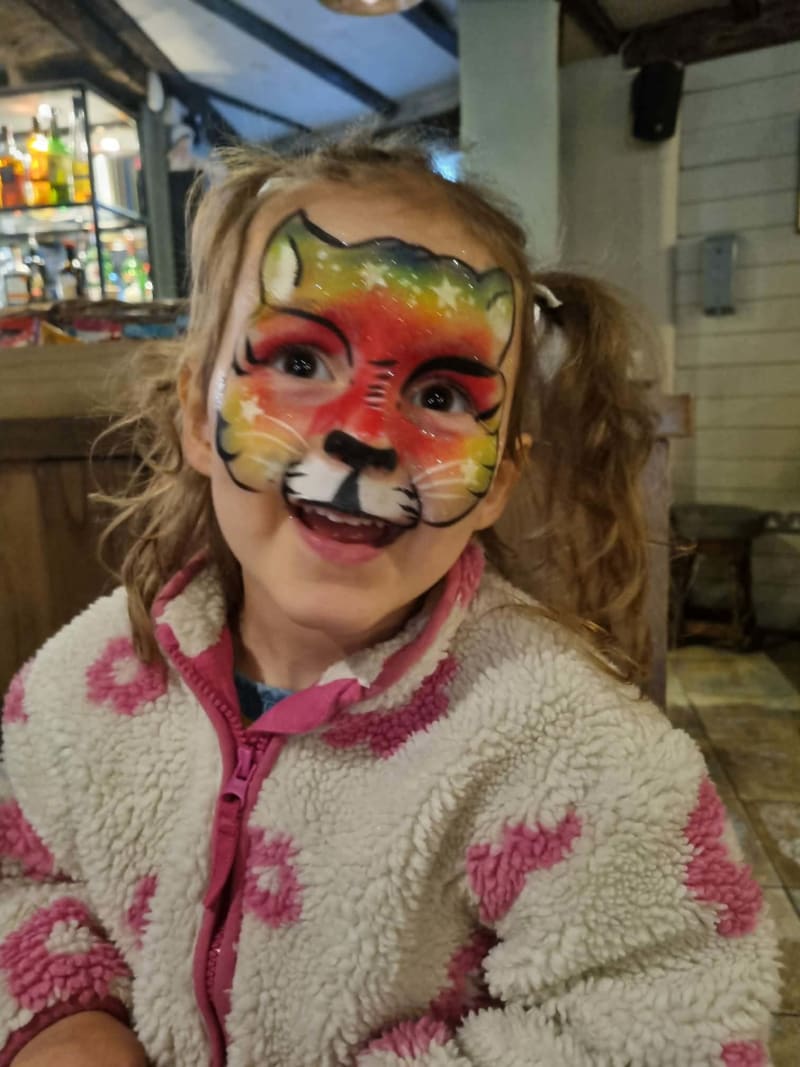 Fun face paint design by Sue