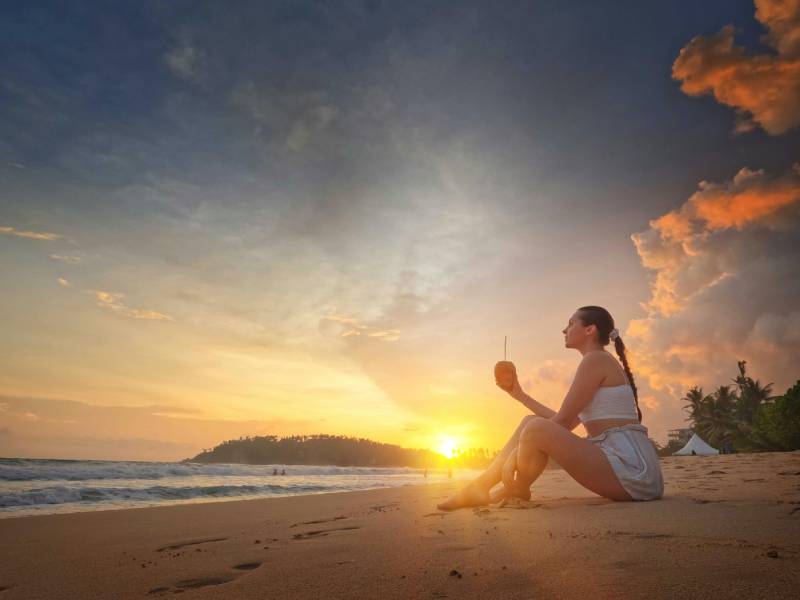 Woman enjoying the sunset on a beach