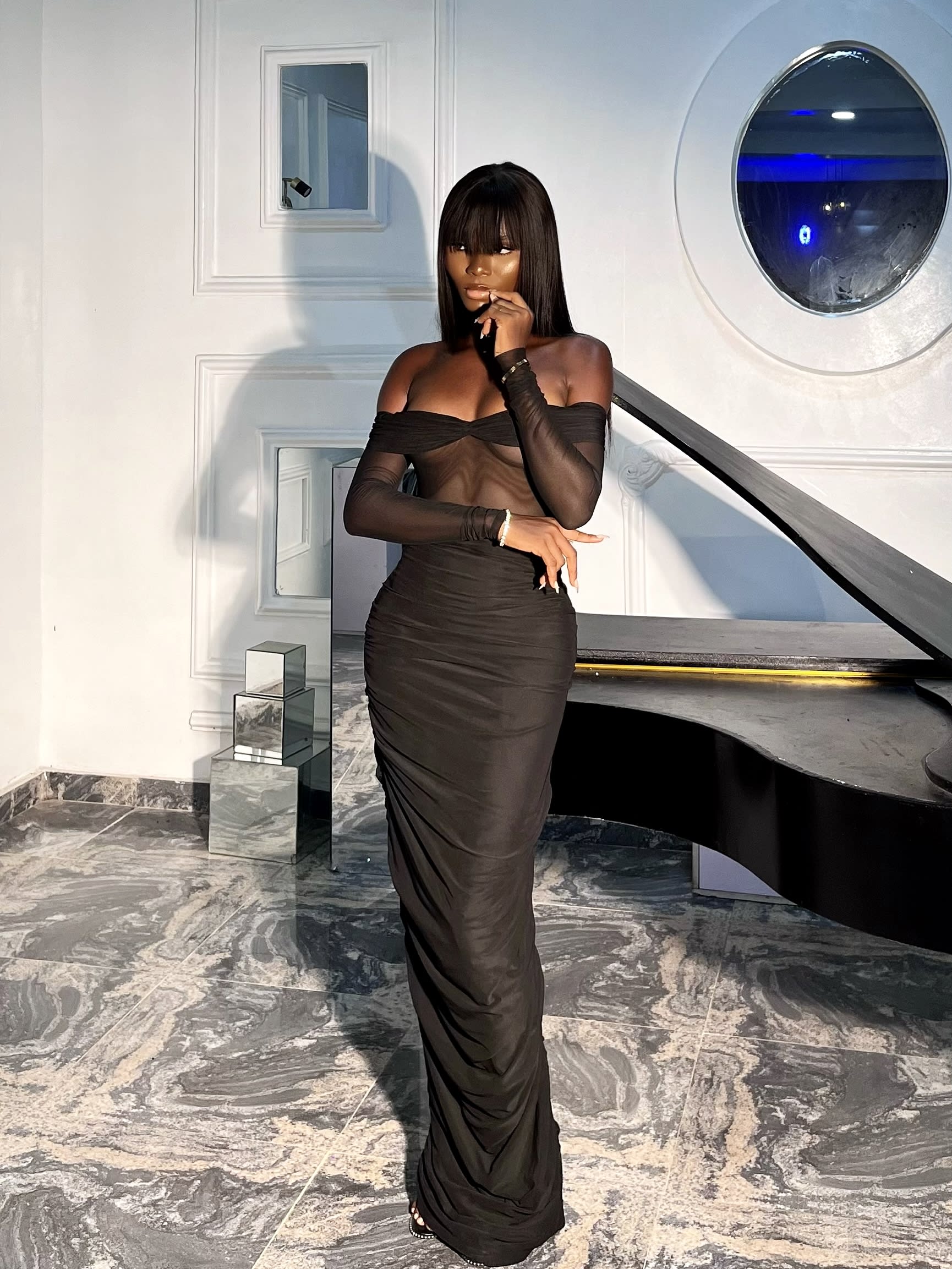 Campaign portrait in a sheer black gown
