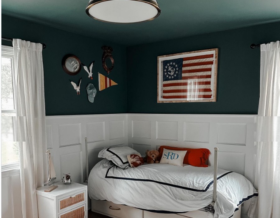 Finished nautical-themed kids bedroom with wainscoting