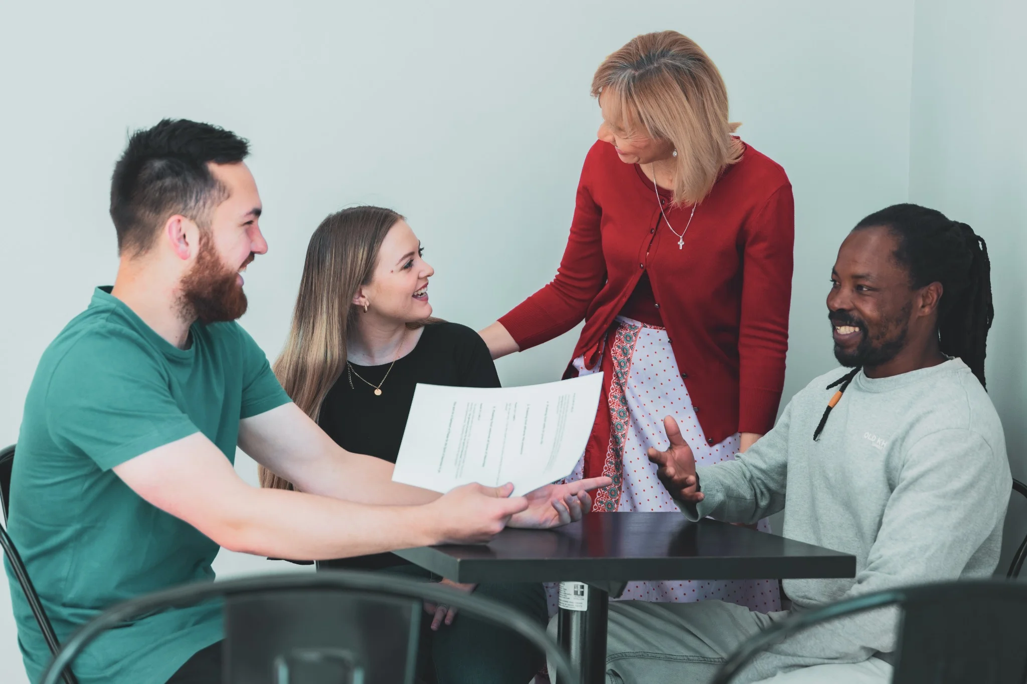 A group meeting in a small circle discussing life