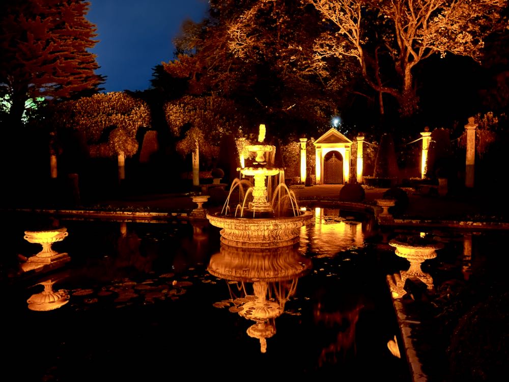 Pond and fountain party lighting creating a magical atmosphere for outdoor celebrations