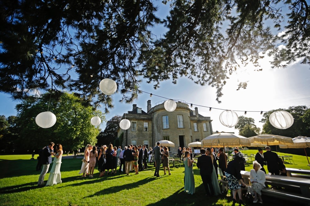 Babington House tree lighting in daytime, elegant exterior lighting design for wedding venues