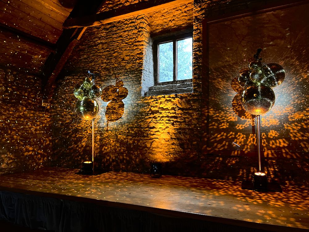Elegant wedding reception with sophisticated lighting design creating a warm and romantic atmosphere with ambient mood lighting