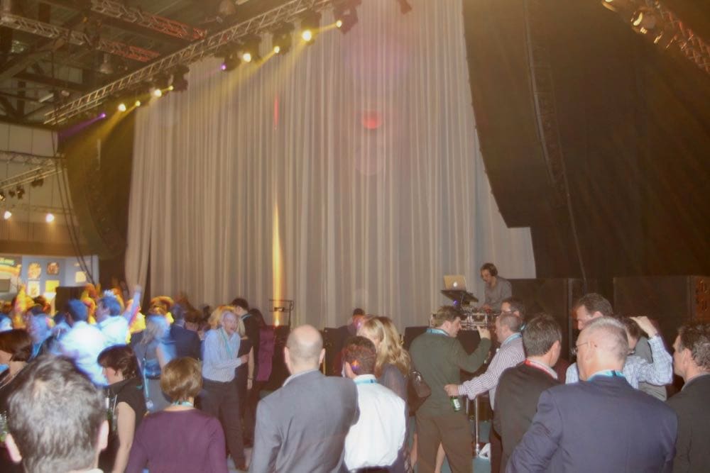 Corporate event with professional entertainment, lighting, and sophisticated atmosphere