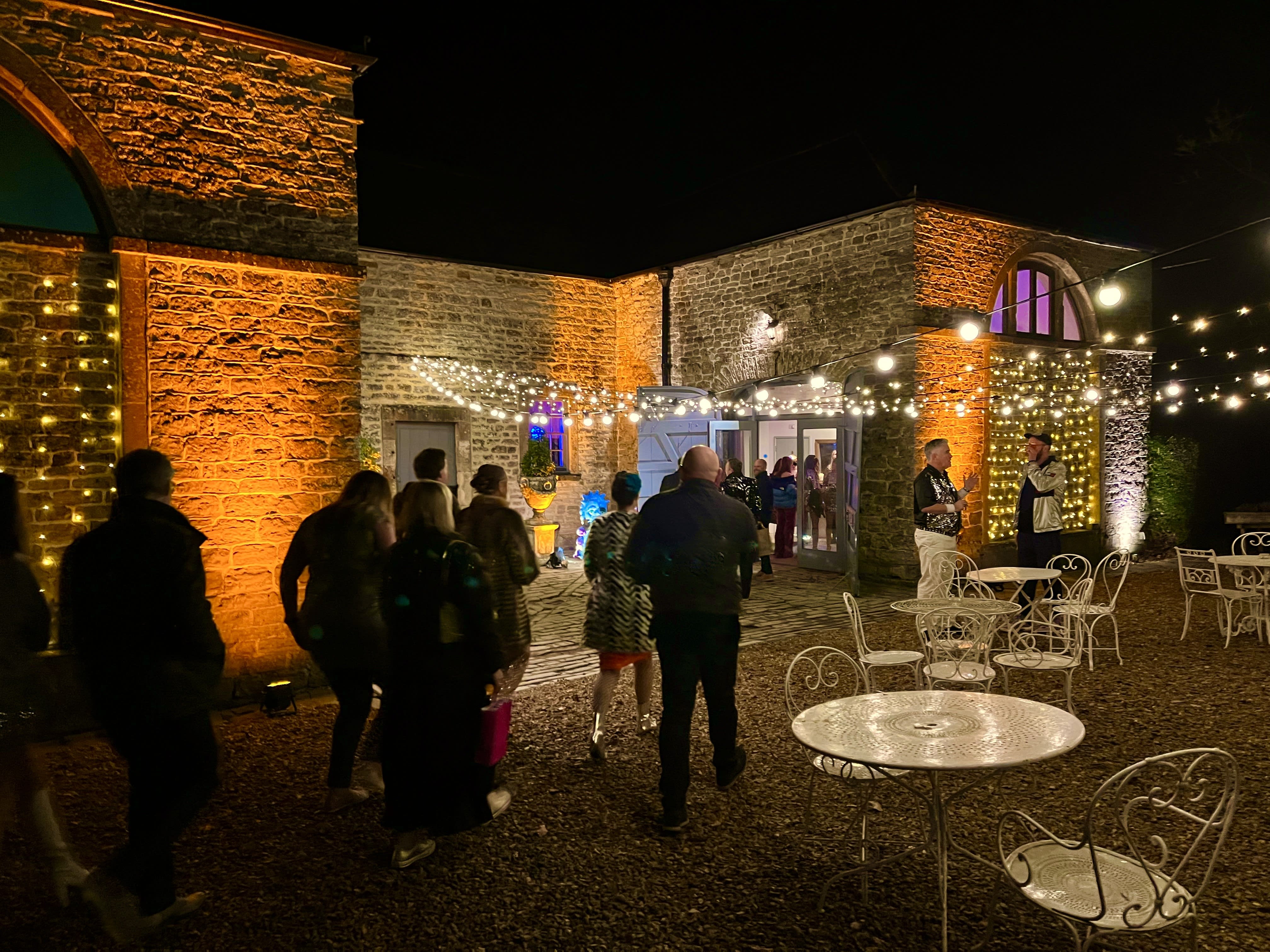 Elegant venue with amber uplighting perfect for sophisticated Christmas celebrations