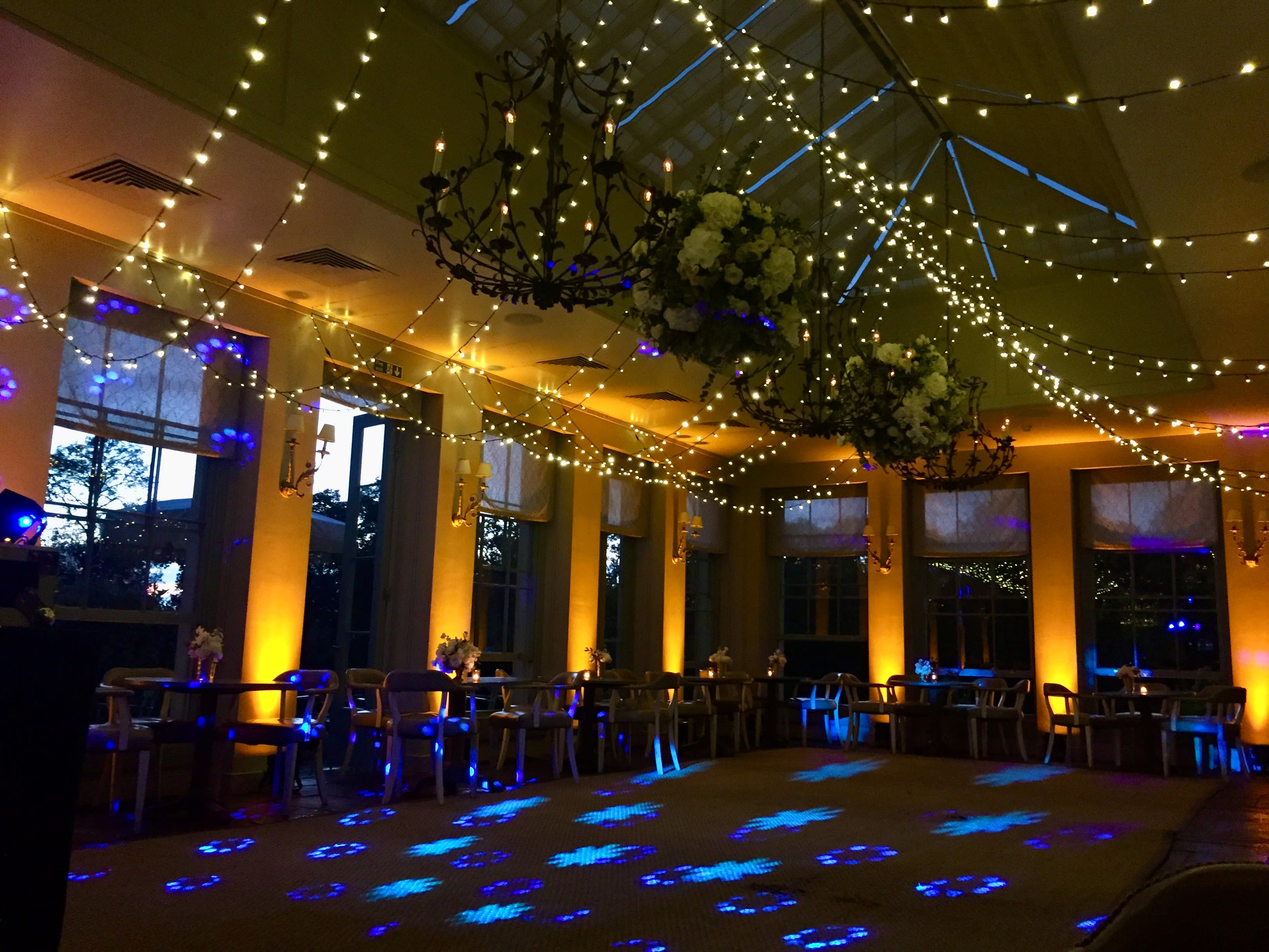 Professional wedding lighting design with atmospheric mood lighting and elegant venue styling