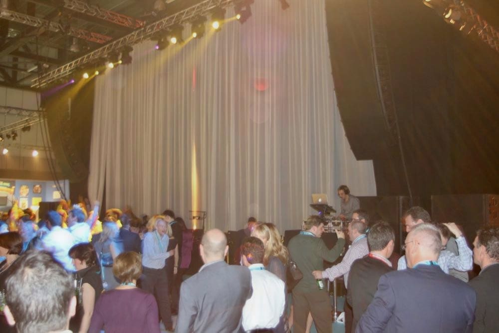 Corporate event with professional entertainment, lighting, and sophisticated atmosphere