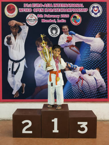 MSKO students displaying medals and certificates at the belt graduation