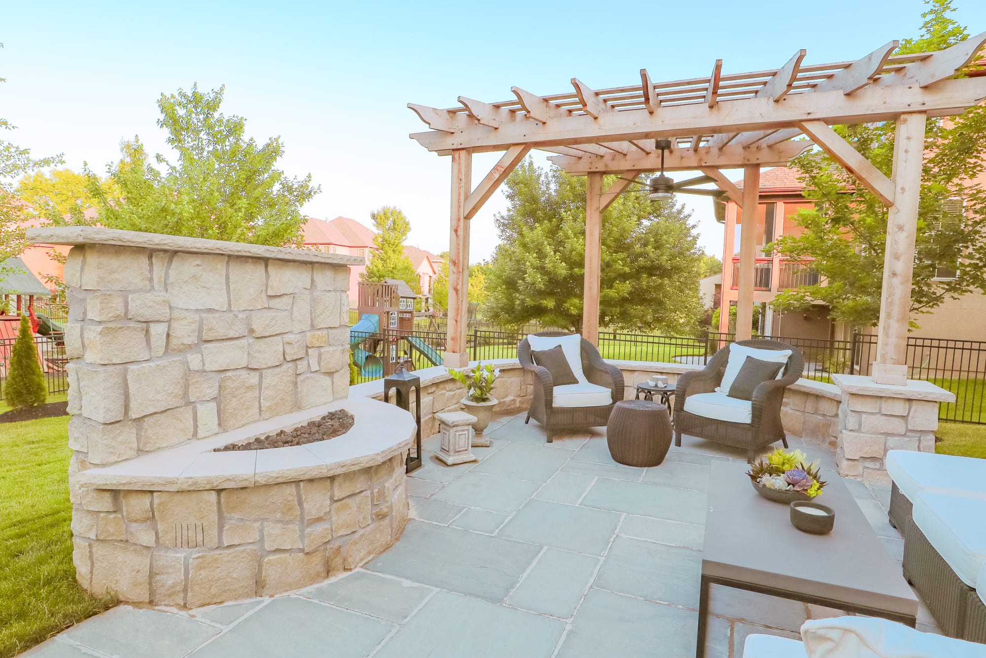Aerial view of a Kansas City Hardscapes gas fire pit, pergola, and grill station build in Overland Park, KS