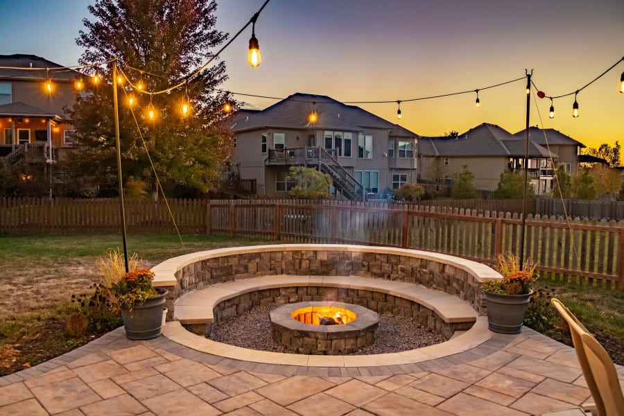 Outdoor living space with seating wall