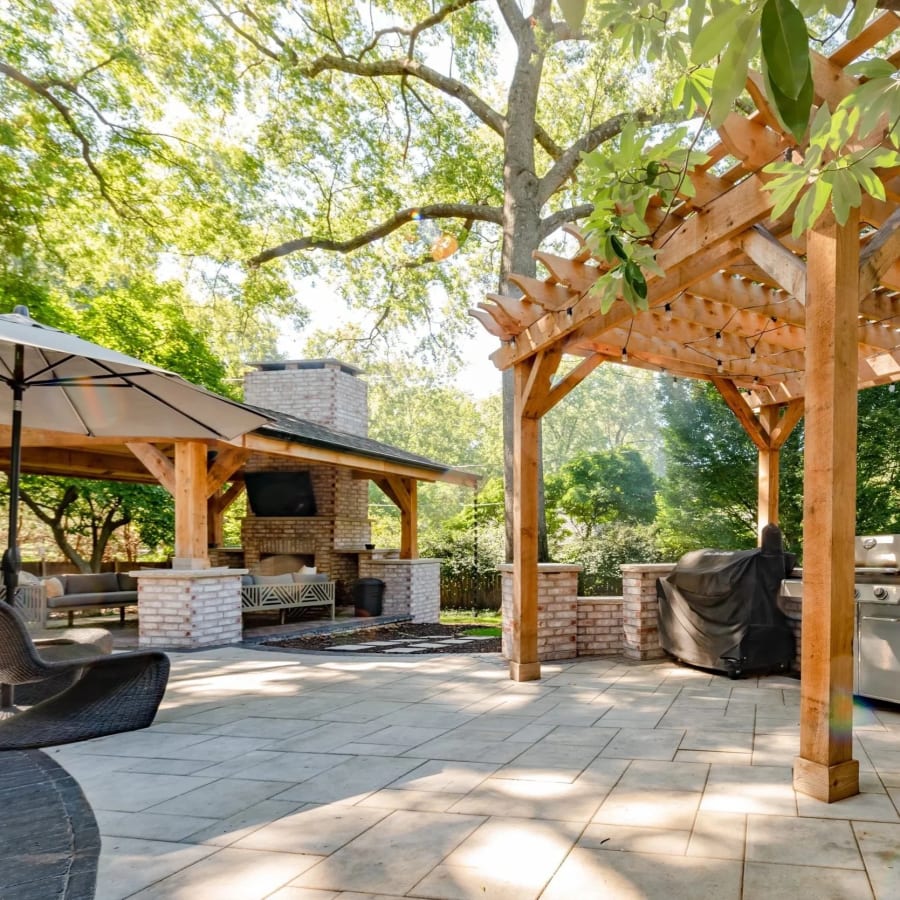 Pavilion and pergola creating shade on a paver patio