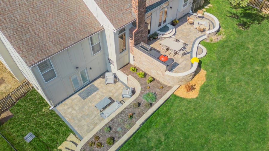 A multi-level hardscape patio built into a sloped Kansas City yard