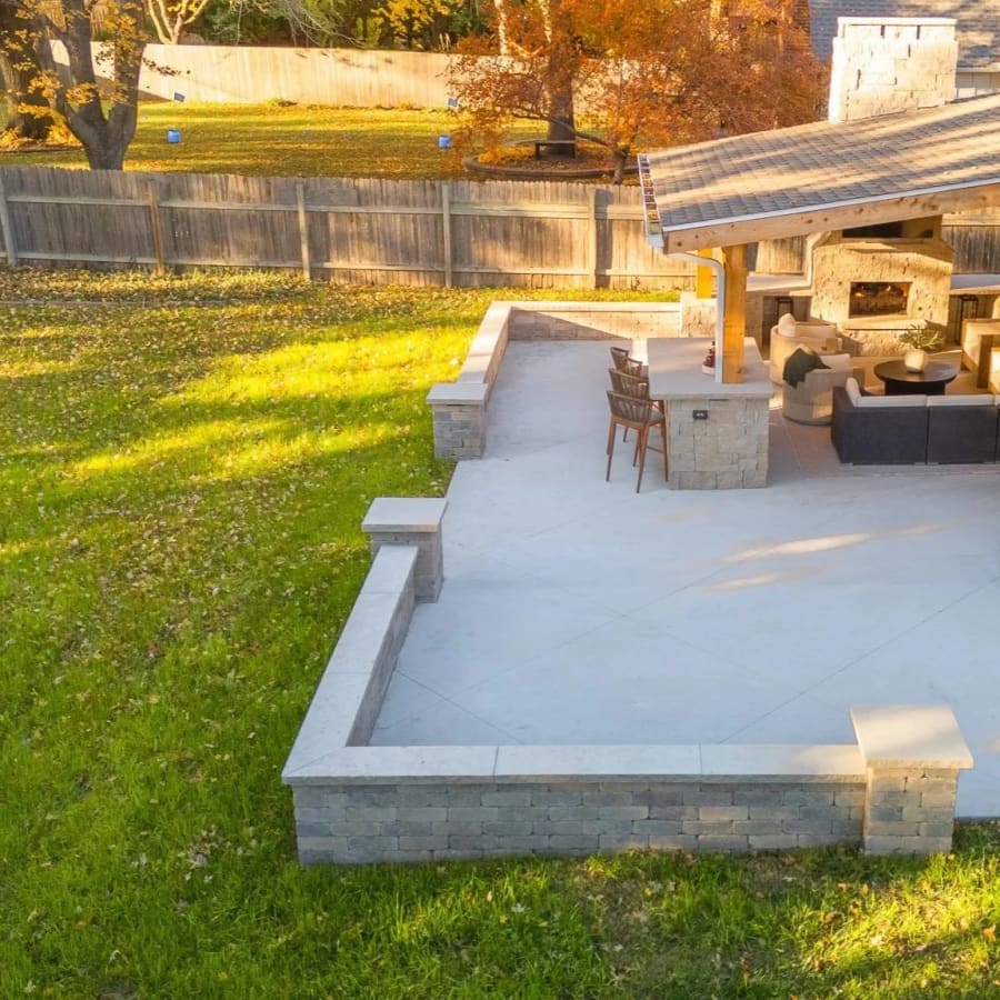 A fire pit patio with pavilion anchoring a Kansas City backyard
