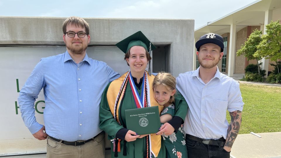 Alexis posing in front of L.V. Berkner High School