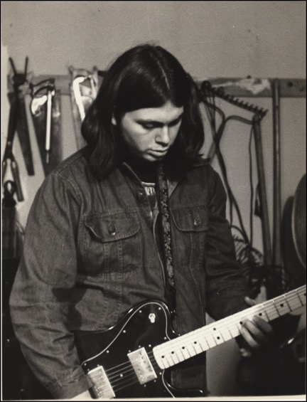 Mark-playing-guitar-in-garage