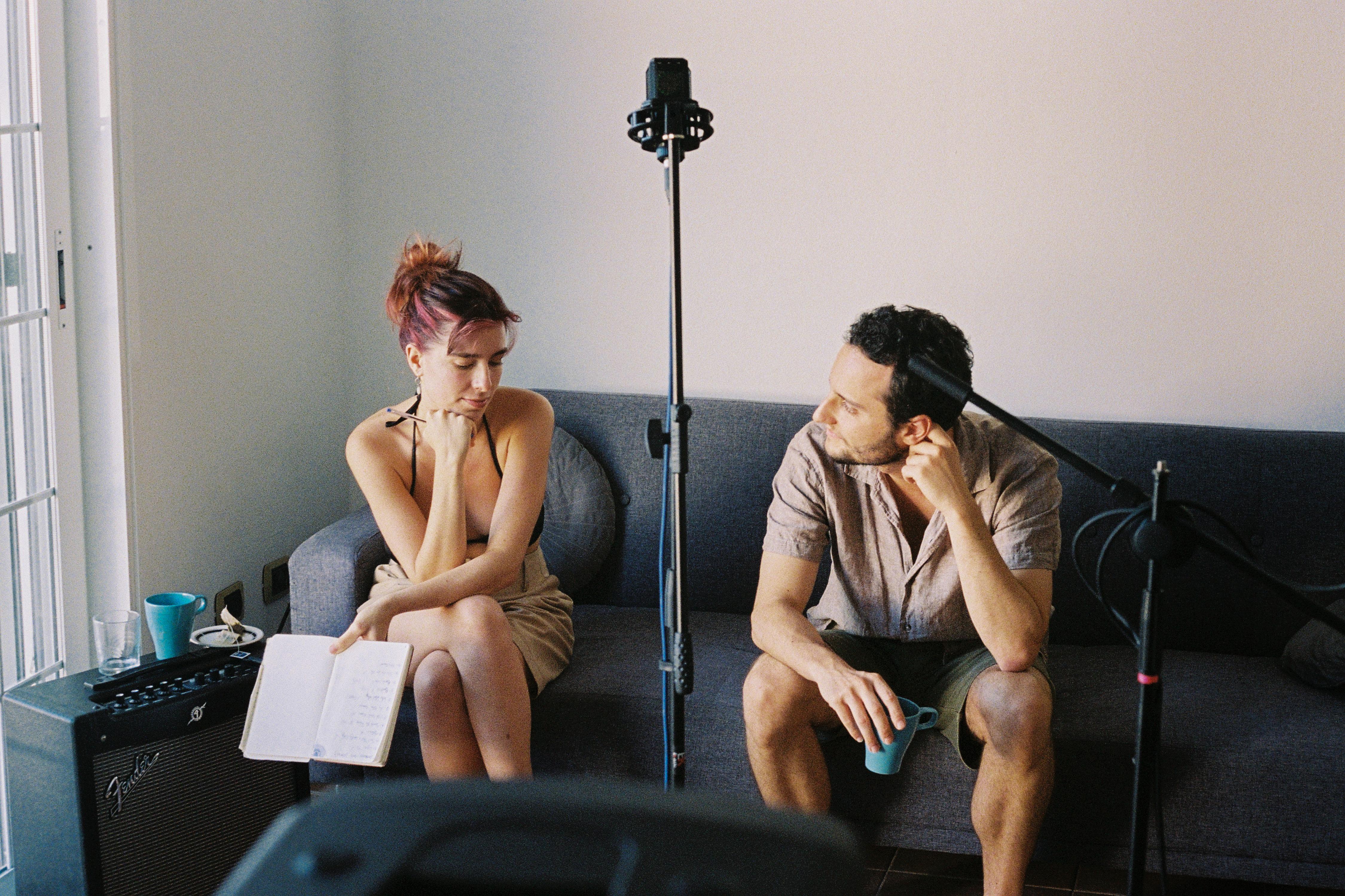 A close-up of hands playing an acoustic guitar.