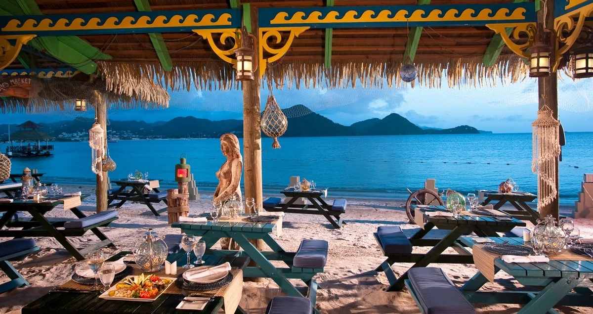 Sandals Grande St Lucian barefoot by the sea.webp