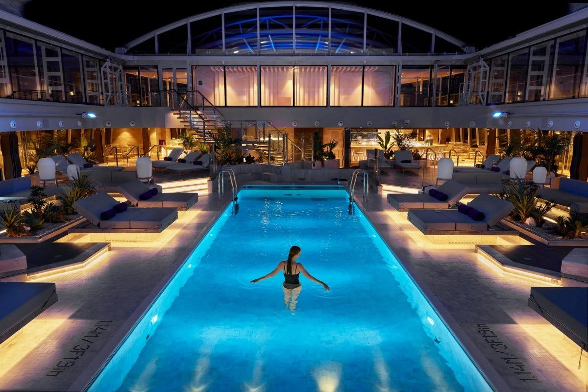 Explora Journeys pool night.webp